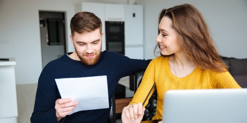 Happy young couple reading